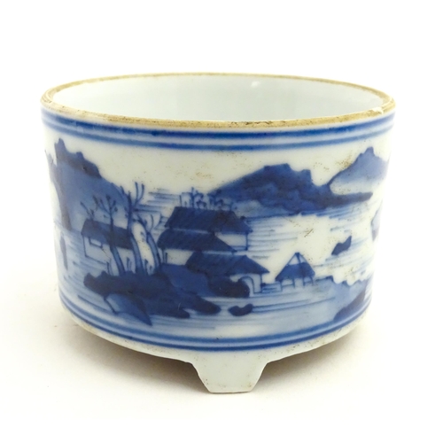 76 - A Chinese blue and white censer raised on three feet and decorated with a river landscape. Approx. 2... 