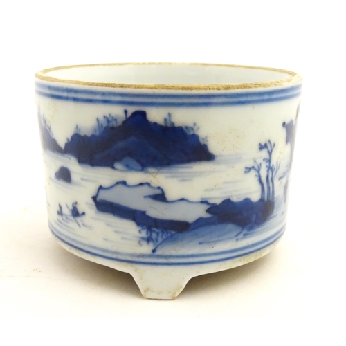 76 - A Chinese blue and white censer raised on three feet and decorated with a river landscape. Approx. 2... 