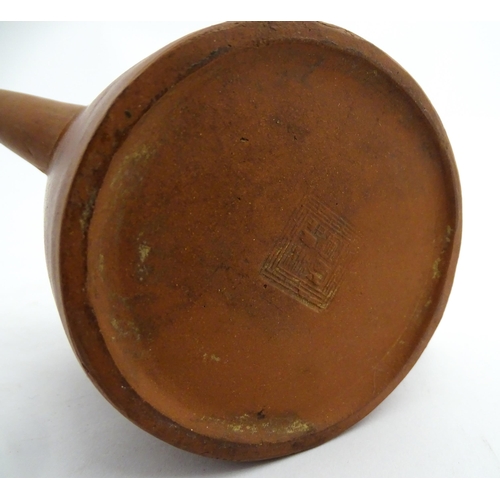 77 - A Chinese yixing teapot with rope detail to lid. Character marks under. Approx. 4 1/2