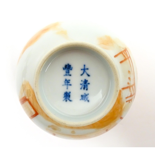 79 - A Chinese iron red lidded tea bowl decorated with a weaving scene and Character script / poem. Lid a... 