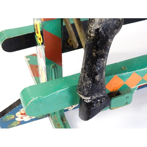 6 - Toy: A 20thC carved wooden rocking horse with hand painted decoration by Norman Dibben of Amersham, ... 