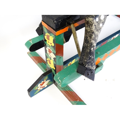 6 - Toy: A 20thC carved wooden rocking horse with hand painted decoration by Norman Dibben of Amersham, ... 