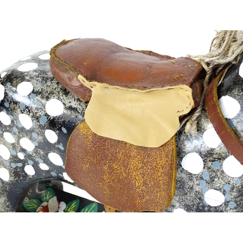 6 - Toy: A 20thC carved wooden rocking horse with hand painted decoration by Norman Dibben of Amersham, ... 
