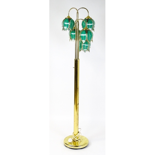34 - A standard lamp with drop flower style green shades. Approx 67
