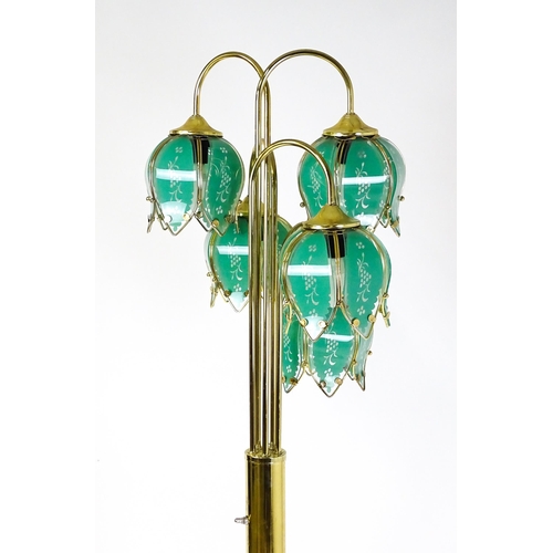 34 - A standard lamp with drop flower style green shades. Approx 67