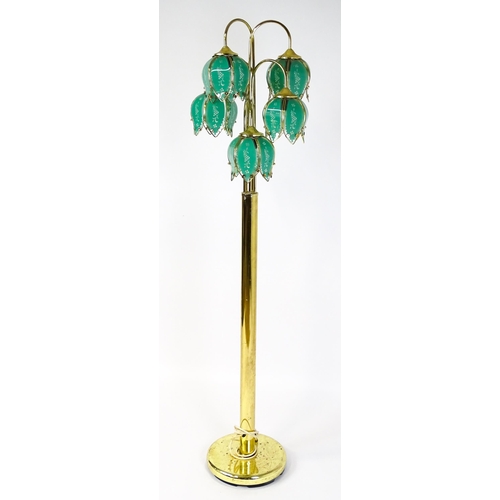 34 - A standard lamp with drop flower style green shades. Approx 67