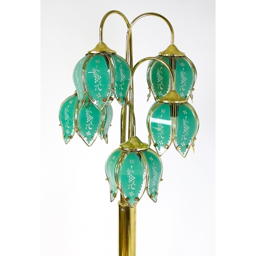 34 - A standard lamp with drop flower style green shades. Approx 67