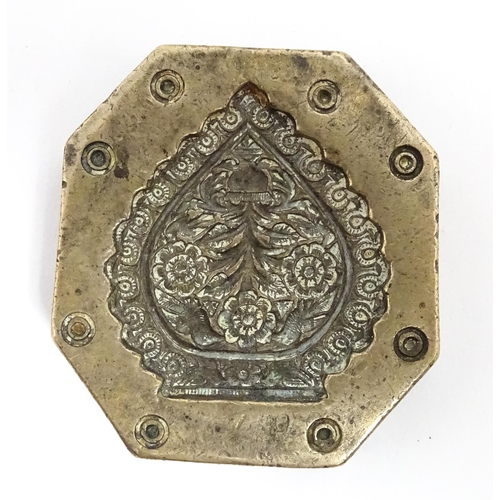 380 - Three Indian cast bronze jeweller's moulds, two having floral and foliate detail, and one of roundel... 