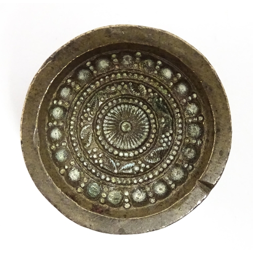 380 - Three Indian cast bronze jeweller's moulds, two having floral and foliate detail, and one of roundel... 