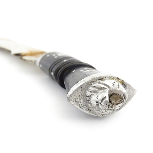 452 - A mid 20thC Indian Kukhri knife with carved horn handle. The leather scabbard with additional chakma... 