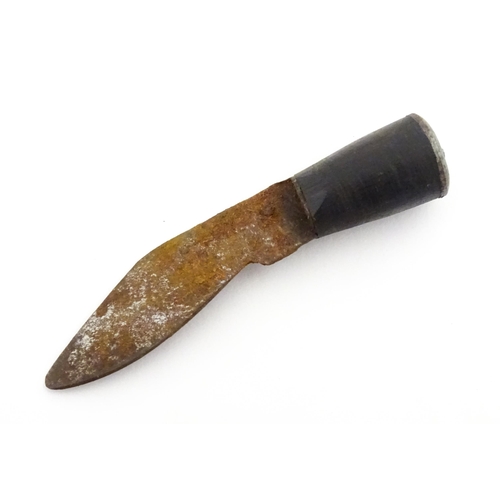 452 - A mid 20thC Indian Kukhri knife with carved horn handle. The leather scabbard with additional chakma... 