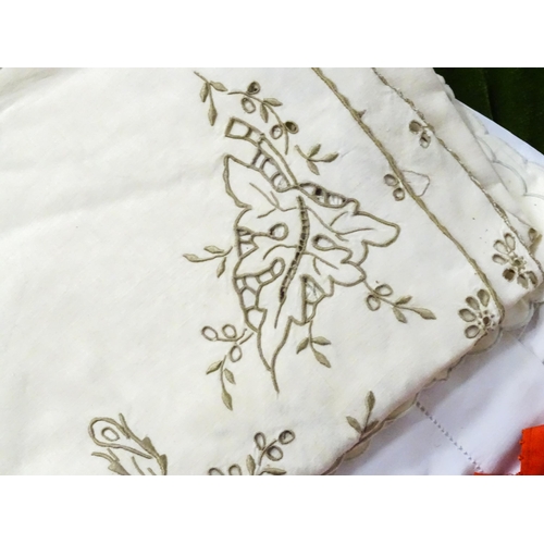 31 - A quantity of assorted textiles to include a 20thC needlework sample with letters of the alphabet by... 