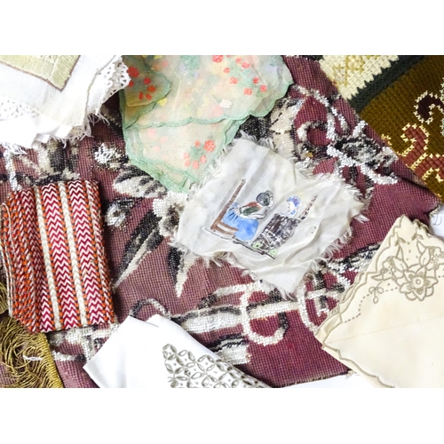 31 - A quantity of assorted textiles to include a 20thC needlework sample with letters of the alphabet by... 