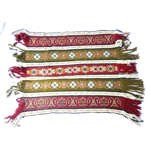 31 - A quantity of assorted textiles to include a 20thC needlework sample with letters of the alphabet by... 