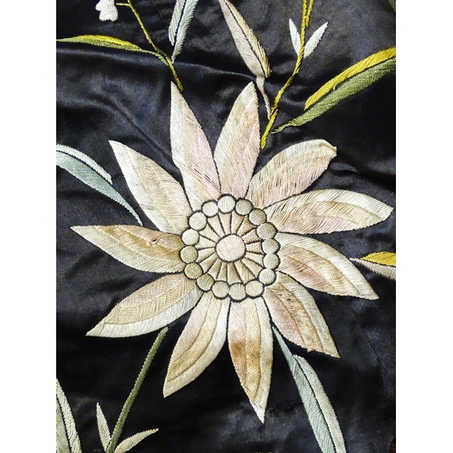 31 - A quantity of assorted textiles to include a 20thC needlework sample with letters of the alphabet by... 