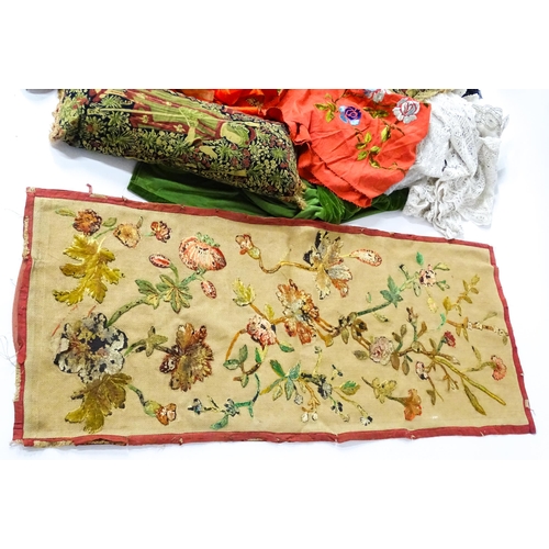 31 - A quantity of assorted textiles to include a 20thC needlework sample with letters of the alphabet by... 