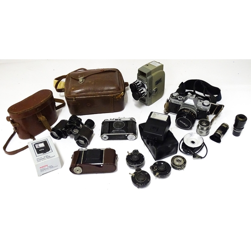 519 - A quantity of assorted film cameras and binoculars to include a Canon AE-1, Sekonic Elmatic 8mm movi... 