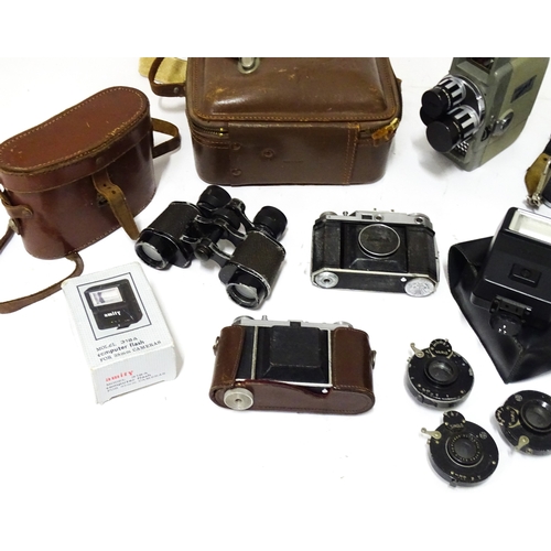 519 - A quantity of assorted film cameras and binoculars to include a Canon AE-1, Sekonic Elmatic 8mm movi... 