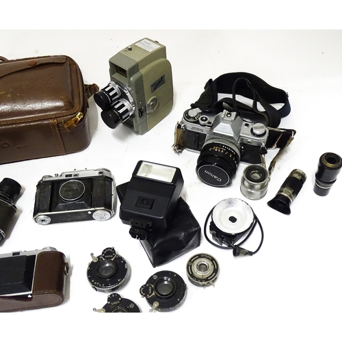 519 - A quantity of assorted film cameras and binoculars to include a Canon AE-1, Sekonic Elmatic 8mm movi... 