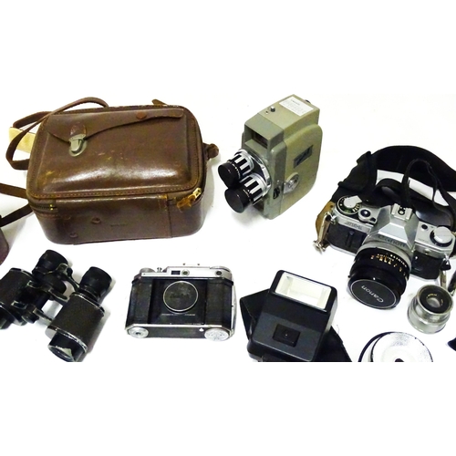 519 - A quantity of assorted film cameras and binoculars to include a Canon AE-1, Sekonic Elmatic 8mm movi... 