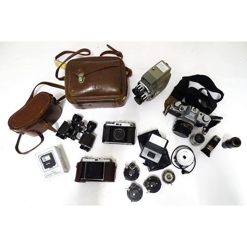 519 - A quantity of assorted film cameras and binoculars to include a Canon AE-1, Sekonic Elmatic 8mm movi... 