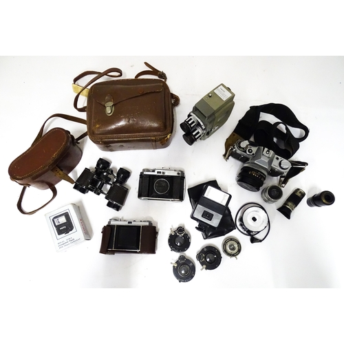 519 - A quantity of assorted film cameras and binoculars to include a Canon AE-1, Sekonic Elmatic 8mm movi... 