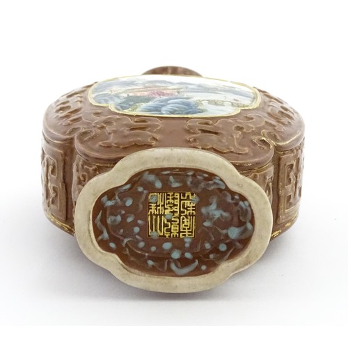 16 - A Chinese famille rose vase with brown ground and gilt highlights, decorated with landscapes and Cha... 