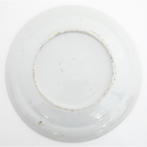 26 - A Chinese / Cantonese famille rose plate decorated with figures, bird, butterflies and flowers. Appr... 