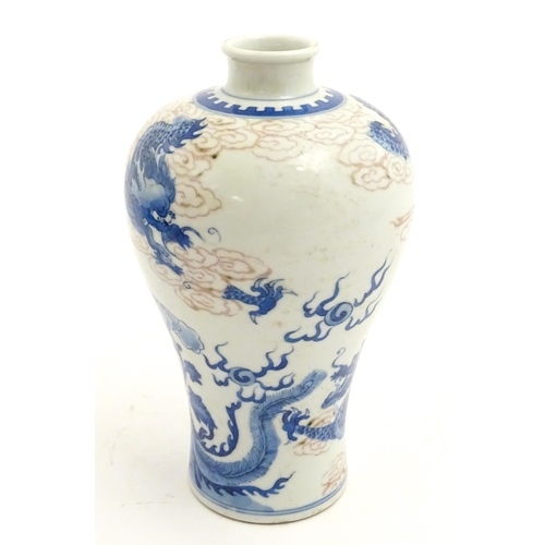 27 - A Chinese blue and white vase decorated with dragons, flaming pearl, phoenix birds and stylised clou... 