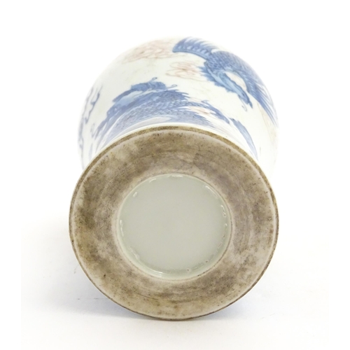 27 - A Chinese blue and white vase decorated with dragons, flaming pearl, phoenix birds and stylised clou... 