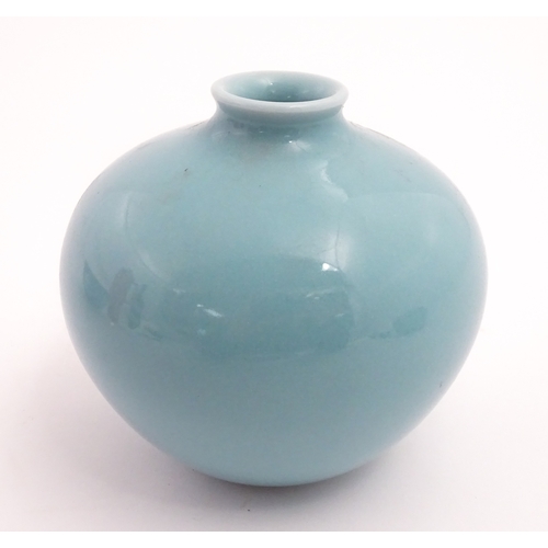28 - A Chinese vase of squat form with turquoise ground. Character marks under. Approx. 4 3/4