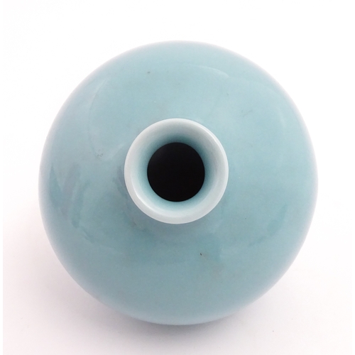 28 - A Chinese vase of squat form with turquoise ground. Character marks under. Approx. 4 3/4