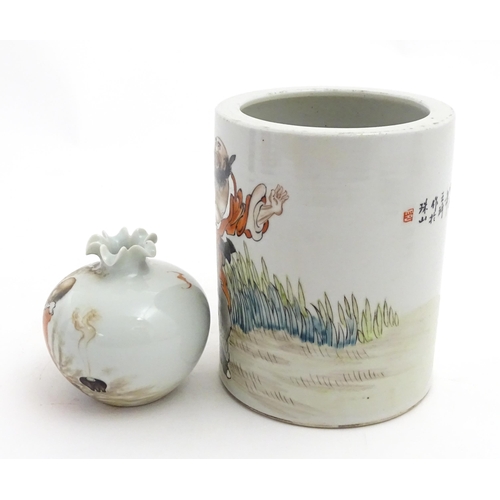 29 - A Chinese brush pot with figural and bat detail with Character script to reverse. Together with a sm... 