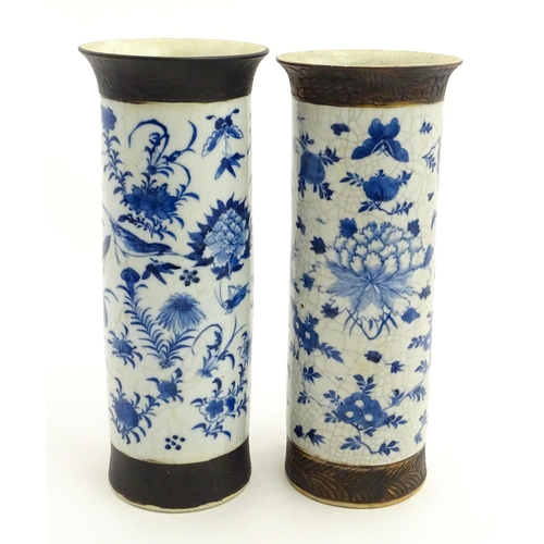 38 - A matched pair of Chinese blue and white vases of cylindrical form, decorated with flowers, birds, i... 
