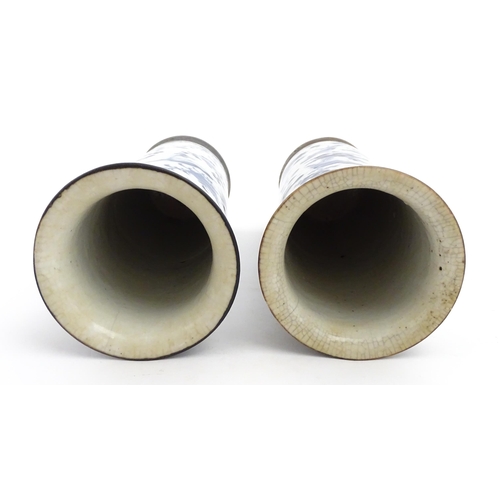 38 - A matched pair of Chinese blue and white vases of cylindrical form, decorated with flowers, birds, i... 