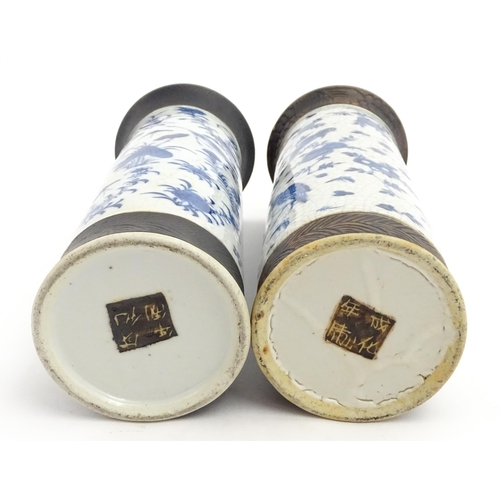 38 - A matched pair of Chinese blue and white vases of cylindrical form, decorated with flowers, birds, i... 