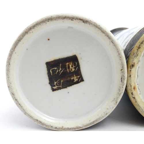38 - A matched pair of Chinese blue and white vases of cylindrical form, decorated with flowers, birds, i... 