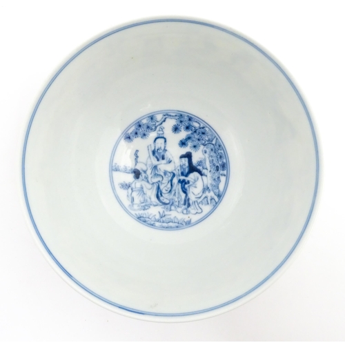 43 - A Chinese blue and white bowl decorated with the Eight Immortals. Character marks under. Approx. 3