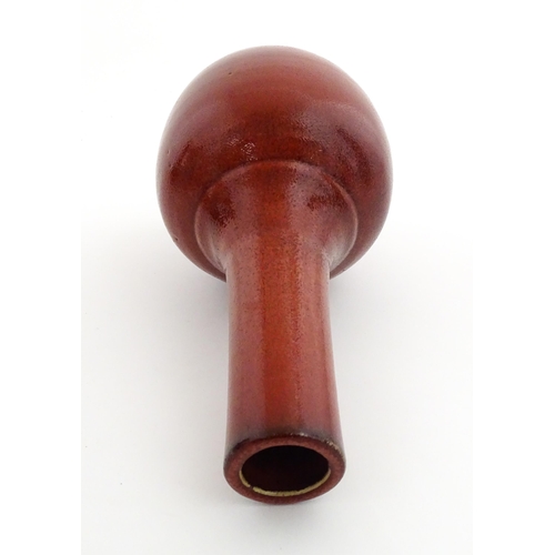 53 - A Chinese bottle vase with red sang de boeuf style glaze. Approx. 13 1/2