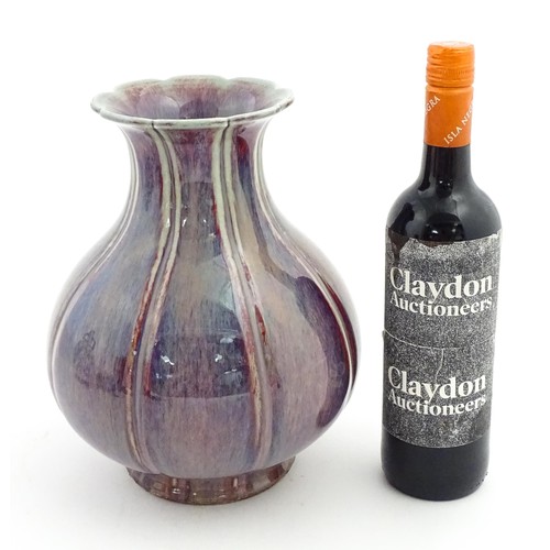 56 - A Chinese sang de boeuf vase of lobed form. Approx. 10 1/2