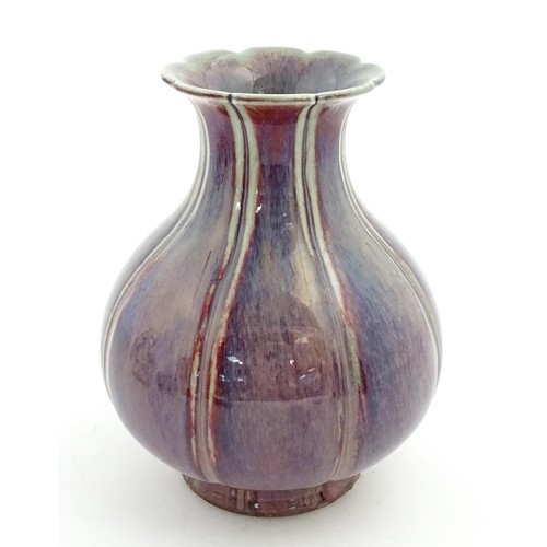 56 - A Chinese sang de boeuf vase of lobed form. Approx. 10 1/2