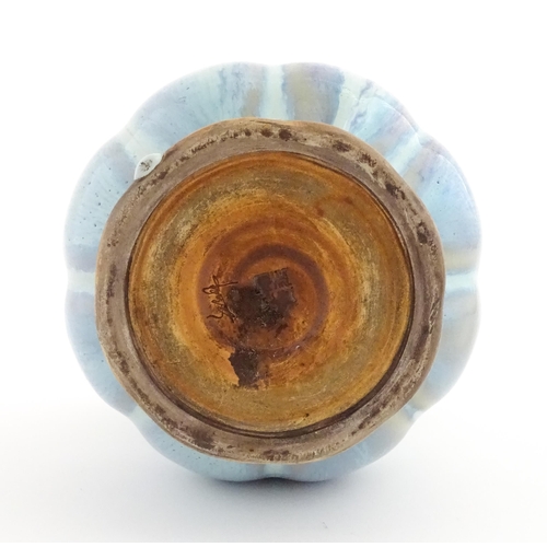 61 - A Chinese high fired twin handled vase of lobed form. Character marks under. Approx. 8 1/4