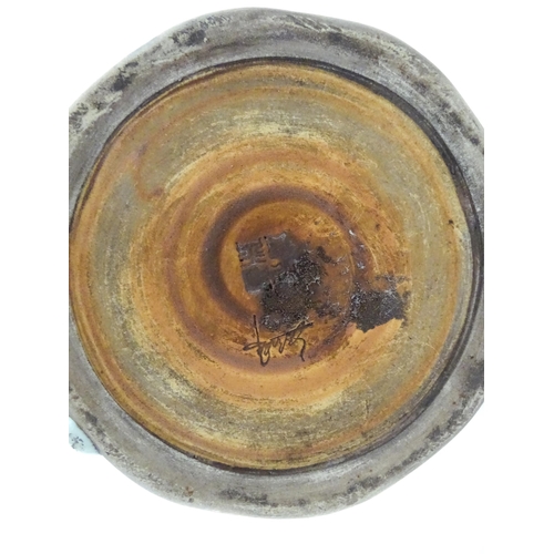 61 - A Chinese high fired twin handled vase of lobed form. Character marks under. Approx. 8 1/4