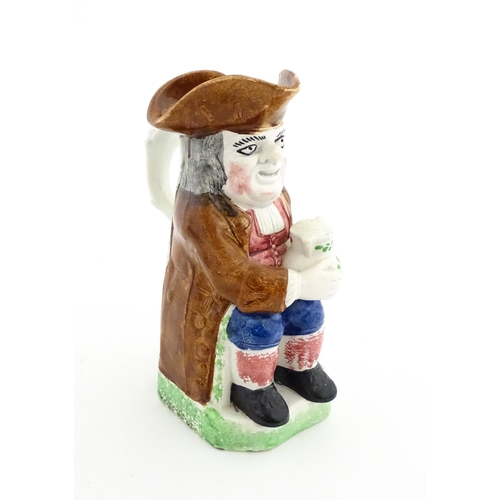 70 - A Staffordshire pottery Toby jug. Approx. 9 1/4