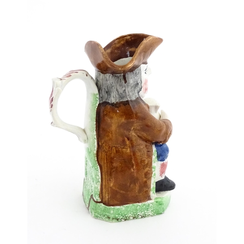 70 - A Staffordshire pottery Toby jug. Approx. 9 1/4