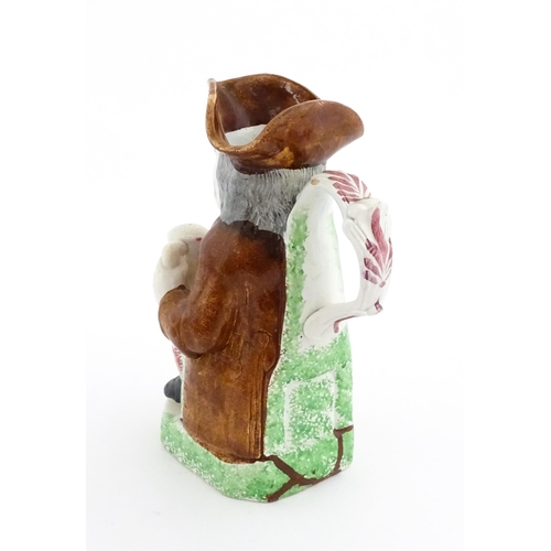 70 - A Staffordshire pottery Toby jug. Approx. 9 1/4