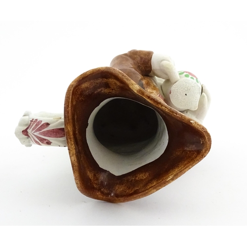 70 - A Staffordshire pottery Toby jug. Approx. 9 1/4