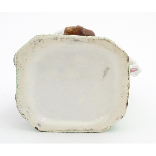 70 - A Staffordshire pottery Toby jug. Approx. 9 1/4