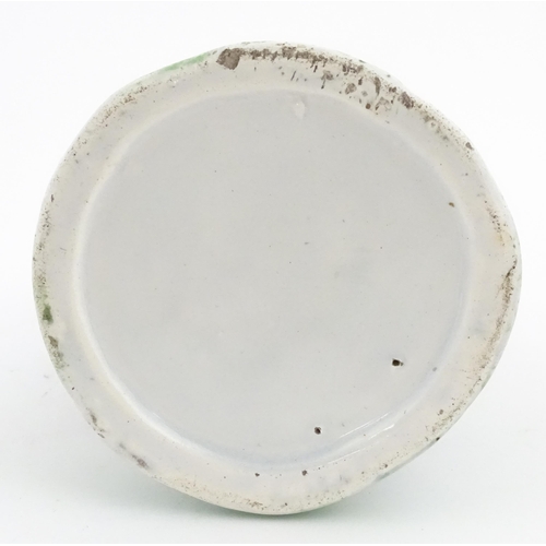 71 - A Staffordshire pottery Lady Snuff Taker Toby jug.  Approx. 9 3/4