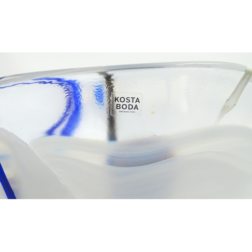 320 - A large Kosta Boda art glass bowl with blue and black detail. Approx. 6 1/2